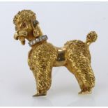 18ct gold brooch in the form of a poodle with a textured finish, diamond collar and ruby eyes. Total