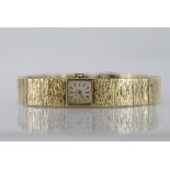 Ladies 9ct cased wristwatch by Jean Renet. The square 11mm dial with gilt baton markers on an