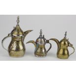 Three Persian / Middle Eastern brass Dallah coffee pots, each with marks & patent number to base,