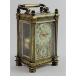 Brass five glass carriage clock, enamel dial with secondary alarm dial surrounded by gilt