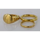 Three rings consisting of, 22ct plain wedding band, weight 7.1g. 18ct yellow gold signet ring,