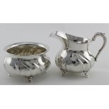 Silver cream & milk jug & sugar bowl (probably German. Both marked with the half moon and crown mark