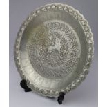 Ceylon interest. An ornately decorated white metal dish, with standing lion to centre, circa 1910,