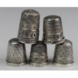 Five silver hallmarked thimbles (two stamped sterling silver), each with embossed place name,