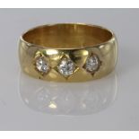 18ct yellow gold diamond three stone gypsy set band ring, diamond weight approx. 0.30ct, finger size