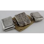 Three silver vesta cases Birm. 1896, 1910, & 1911. Two plain & one attractively decorated. Weighs