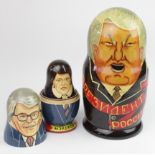 Two novelty sets of Russian dolls, depicting the Russian presidents and the British prime ministers,
