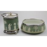 Wedgwood. Two green jasperware items, comprising biscuit barrel & fruit bowl