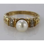 9ct Gold Pearl and CZ Ring size O weight 3.1g