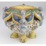 An unusual Continental bowl, raised on four feet, decorated with winged figures, circa late 19th