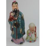 Two hand painted Chinese figures, one with impressed marks to base, tallest 24cm approx. (sold as