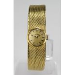 Ladies 18ct cased Omega wristwatch, circa 1966, on an integral 18ct bracelet. Watch working when
