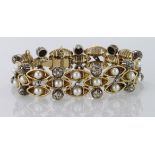 Yellow metal (tests and marked 18ct) Diamond and Pearl set Bracelet with safety chain weight 47.6g