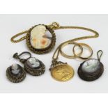 Victorian half sovereign on a yellow metal chain along with other mixed jewellery in a old pouch