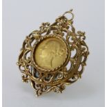 Victorian shieldback sovereign dated 1857 in an ornate 9ct pendant mount, total weight 20.6g