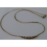 9ct yellow gold necklace set with seven diamonds totalling 0.50ct, weight 7.4g