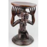 African Luba tribe foot stool, depicting a kneeling African woman, height 45cm, diameter 28cm