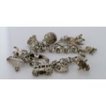 Silver / white metal charm bracelet with a good variety of charms attached, total weight 65.4g