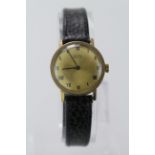 9ct cased Vertex "Revue" wristwatch, the gilt 25mm dial with black roman numerals, on a later strap,