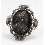 Victorian white metal & jet cameo brooch, depicting a lady in profile with gilt head headdress, 45mm