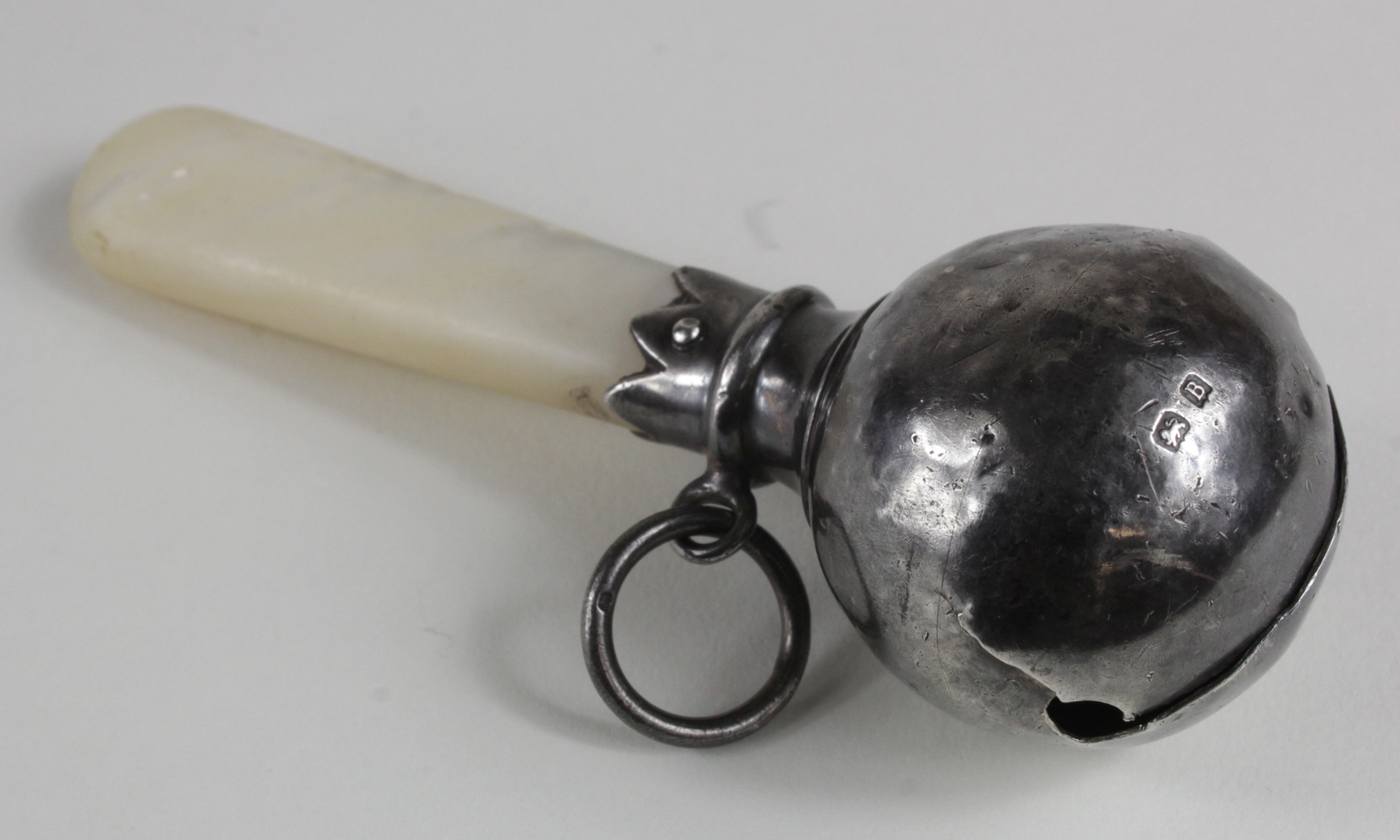 Victorian George Unite silver child's rattle, with mother of pearl teether, hallmarked 'GU,