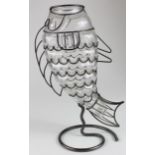 Vase. An unusual glass vase in the form of a fish, moulded into a metal stand, height 25.5cm