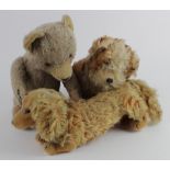 Three old teddy bears, including a Steiff Waldi in the shape of a dog (with button and label)