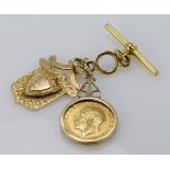 9ct gold hallmarked "T" bar with 9ct fob and George V sovereign dated 1911 attached. Total weight