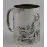 Edwardian silver christening mug. On the front has an embossed scene of a girl feeding chickens,