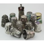 Thirteen mostly white metal thimbles, including arts & crafts, enamel, filigree examples etc.