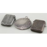 Three silver vesta cases hallmarked respectively - Chester 1903, Birm. 1905 and 1912.