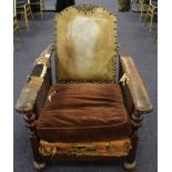 Victorian oak framed gothic revival reclining armchair, with leather base, arms & back, cane