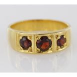 Yellow metal (tests 14ct) Garnet set Ring size J weight 5.2g