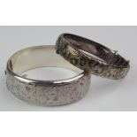Two modern silver bangles hallmarked Birm. 1963 and 1973. Weigh 1.5oz. approx.