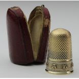French yellow metal (tests as 15ct Gold) thimble, with band of embossed letters, weight 4.6g
