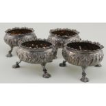 Four silver 18th c. Circular salts with gilt interiors - each have some holes caused by over-