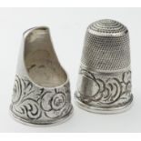 Two Victorian white metal thimbles, each with engraved floral decoration