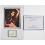 Raquel Welsh signed and double mounted image with signature on white card below the image