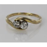 18ct yellow gold ring set with two diamonds calculated as weighing approx. 0.30ct, fiinger size N,