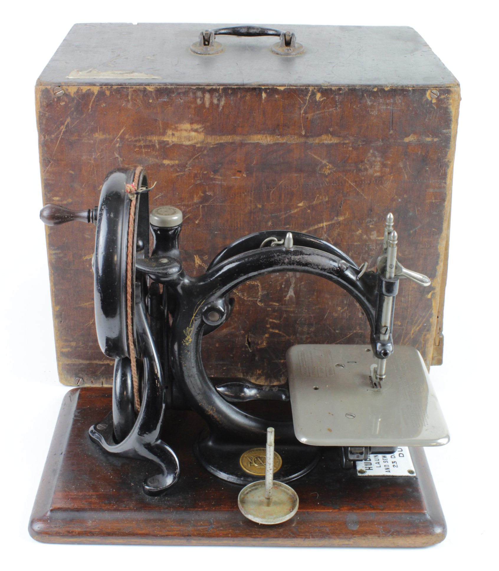 Willcox & Gibbs sewing machine on an oak base, height 25cm, length 33cmcm approx. contained in a