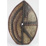 Nigerian carved wood shield, circa early 20th Century, 59.5cm x 39.5cm