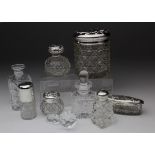 Eight cut glass vanity bottles / pots, including perfume bottles, etc., six with silver hallmarked