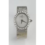 Baume & Mercier 18ct white Gold ladies wristwatch, the oval dial with silvered face surrounded by