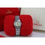 Ladies Omega Constellation quartz wristwatch circa 2003. The round cream dial with baton markers. On