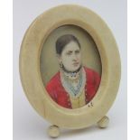 Portrait Miniature. Oil on ivory, circa 19th Century, depicting a Continental woman wearing gold