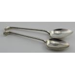 Two chunky silver golf spoons both marked "lGC". They measure 11.5cm and 12.2cm - their combined