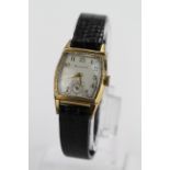 Gents Bulova 10ct gold plated wristwatch circa 1954. The square cream dial with arabic numerals