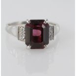 18ct white gold rectangular garnet ring with diamond shoulders, finger size M weight 4.9g