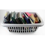 World mix in a large plastic basket, including several stockbooks and albums, some on/off paper