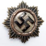 German WW2 Deutches Kreuz in Gold, some service wear to highlights but enamel good, 4x rivet